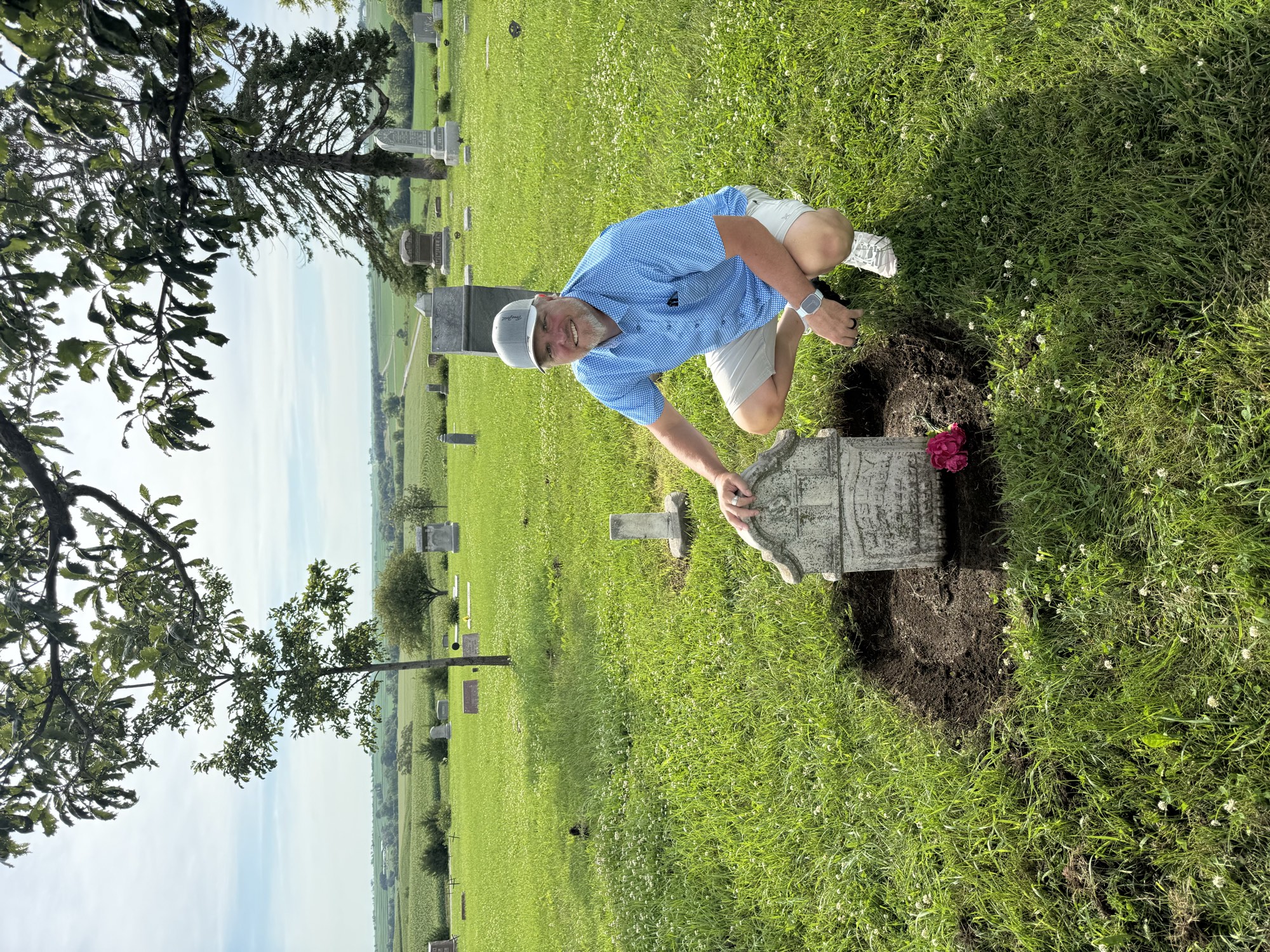 The founder standing at the grave of his third great-grandfather, Wesley Fletcher, Farm Creek Cemetery, Henderson, Iowa