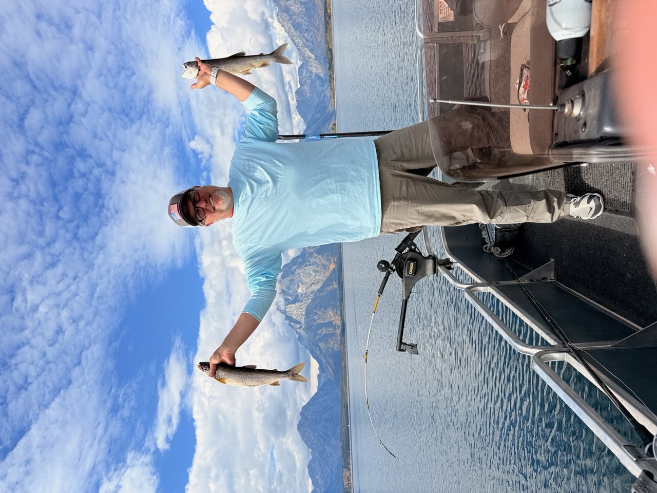 The founder fishing on his late father's boat, the Grand Tetons behind him